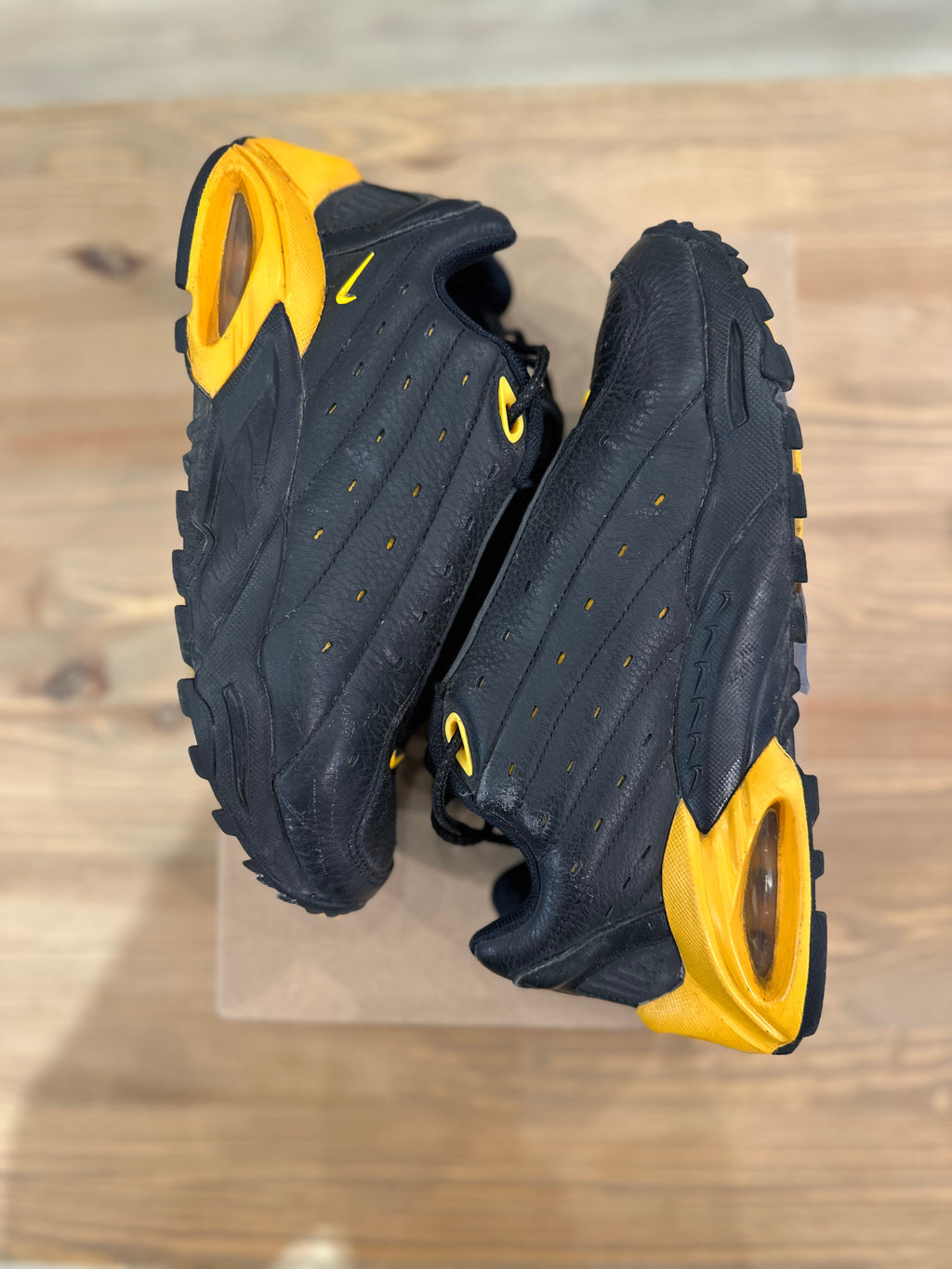 Nike nocta hot step black university gold